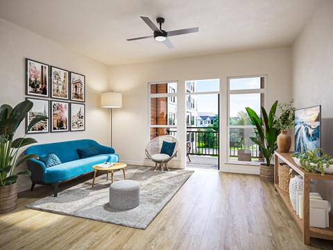 a living room with a blue couch and a ceiling fan
